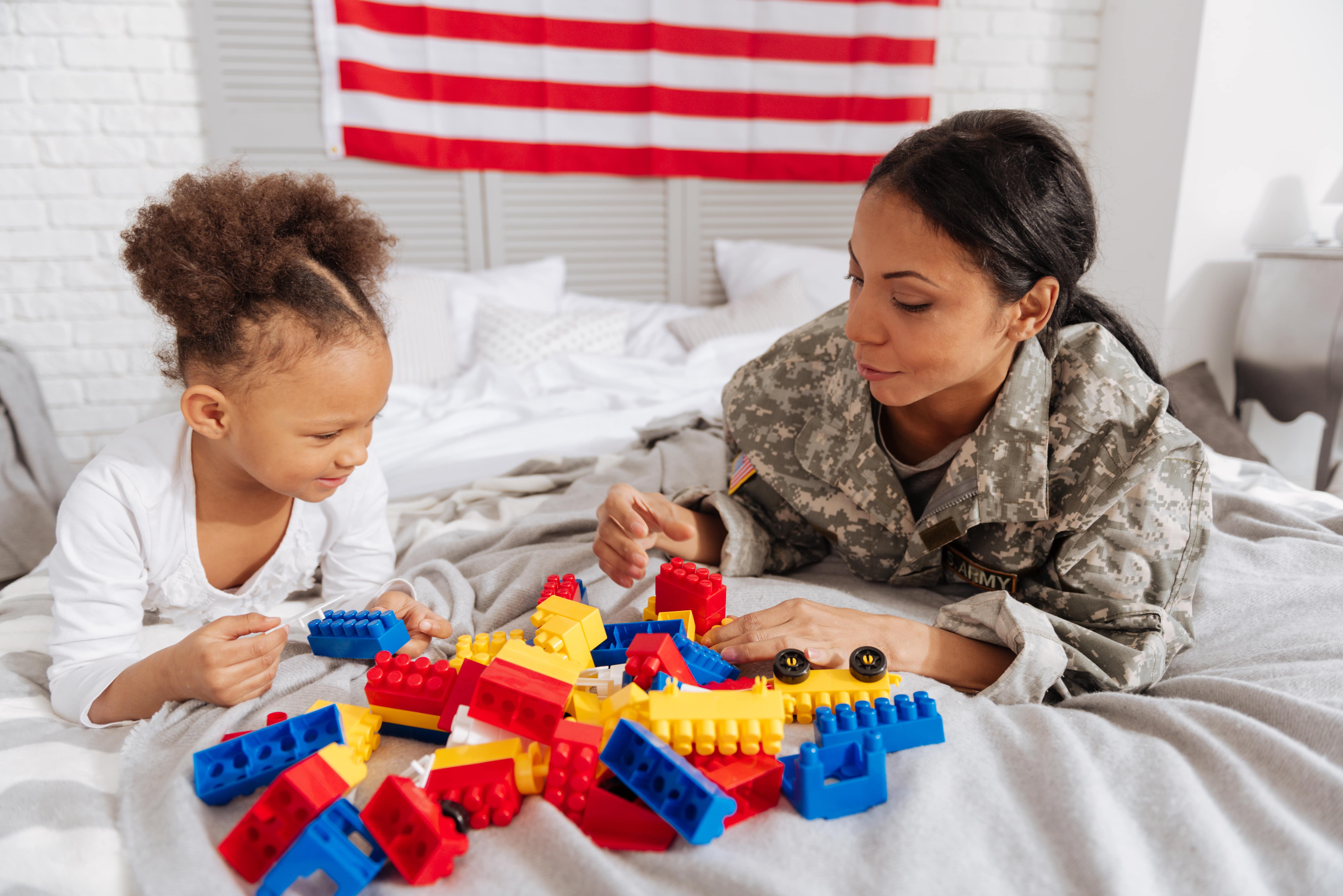 military mother playing with her daughter